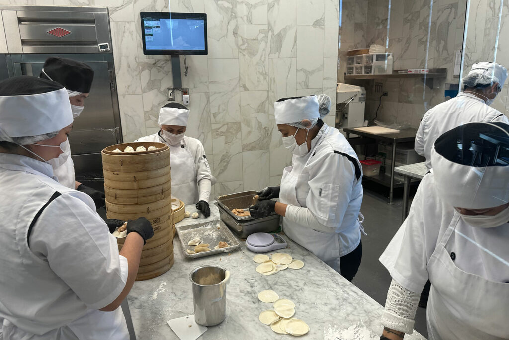 The artisans making my soup dumplings with amazing care and precision. 