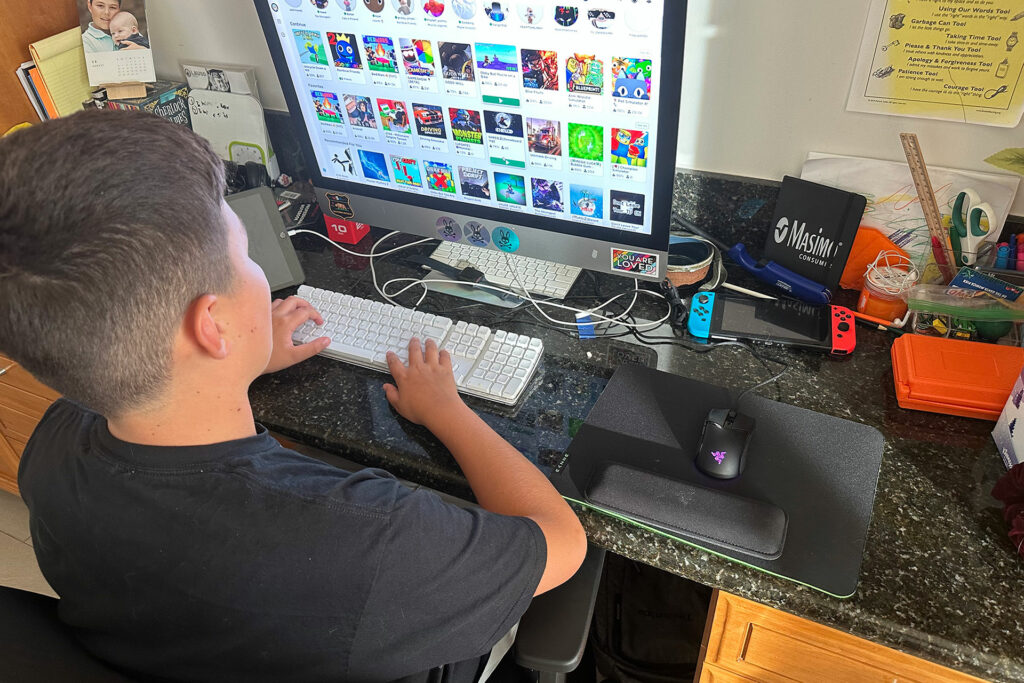 My 11-year-old son getting ready to play ROBLOX with his $300 mouse. 