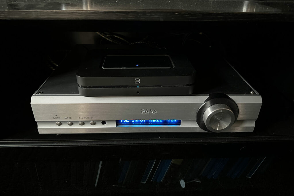 Note the Bluesound Node parked on top of a Pass Labs XP-12 audiophile stereo preamp