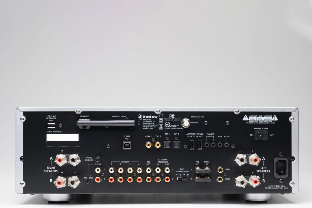 A rear look at the Outlaw Audio RS2166 integrated amp with many inputs and outputs.