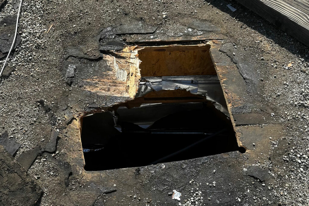 The hole in the roof that the robbers hauled gear from with a net.