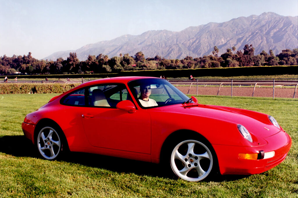 Our publisher, years ago in his red 911 at a car show near Pasadena, California.