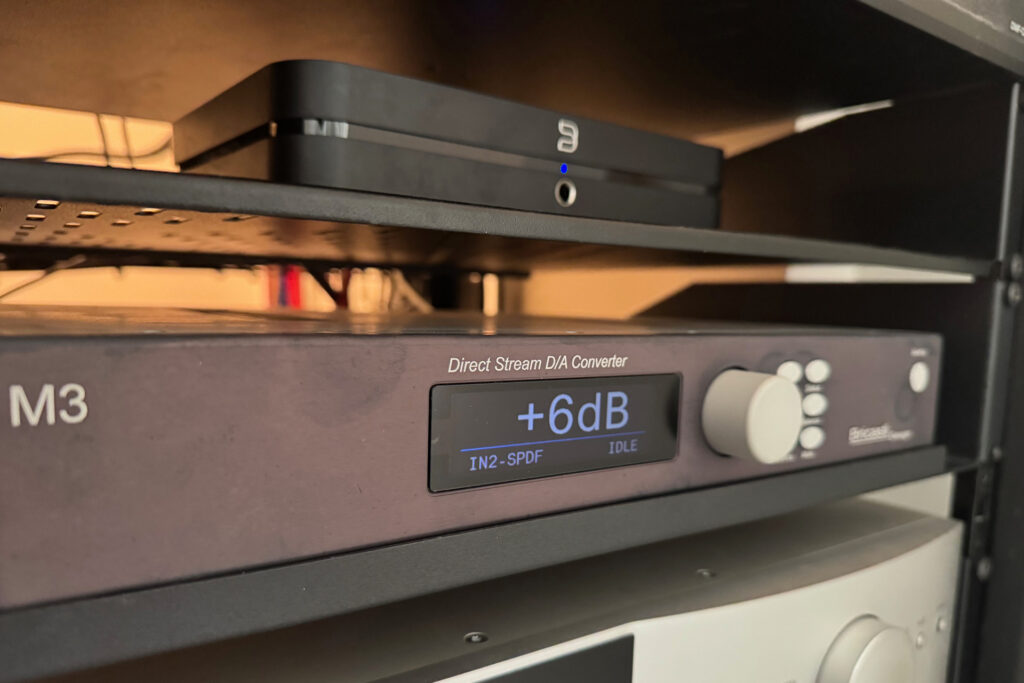 A Bricasti DAC with a discolored faceplate.