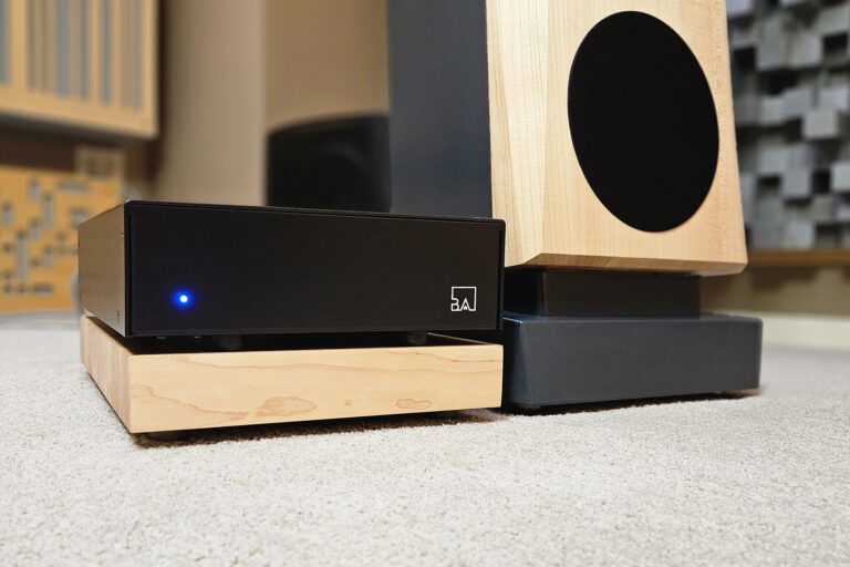 Buckeye's latest Hypex-based Class-D amp installed next to Mike Prager's Janszen speakers.