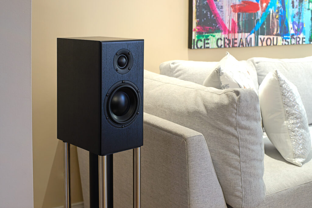 The Totem Bison speaker benefiting acoustically from a nearby sofa.