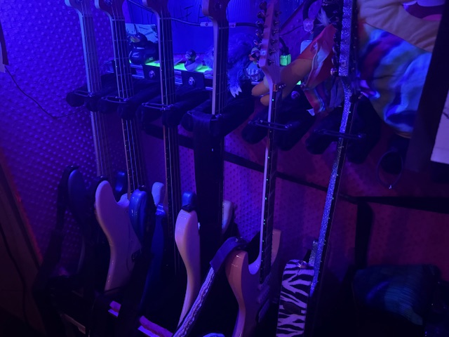 A rack of guitars waiting to be played backstage at the Turnstile show near USC.