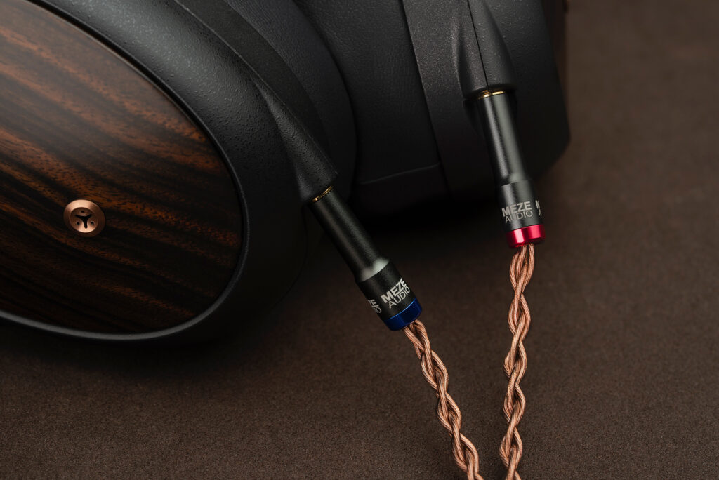 A close up of the way the bradded cables attach to the Meze Liric headphones.