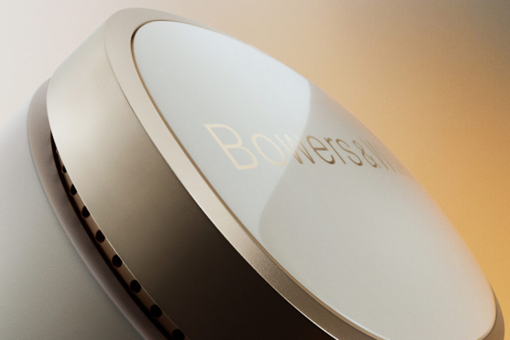 A close up of the Bowers & Wilkins Pi8 in white with gold accents.