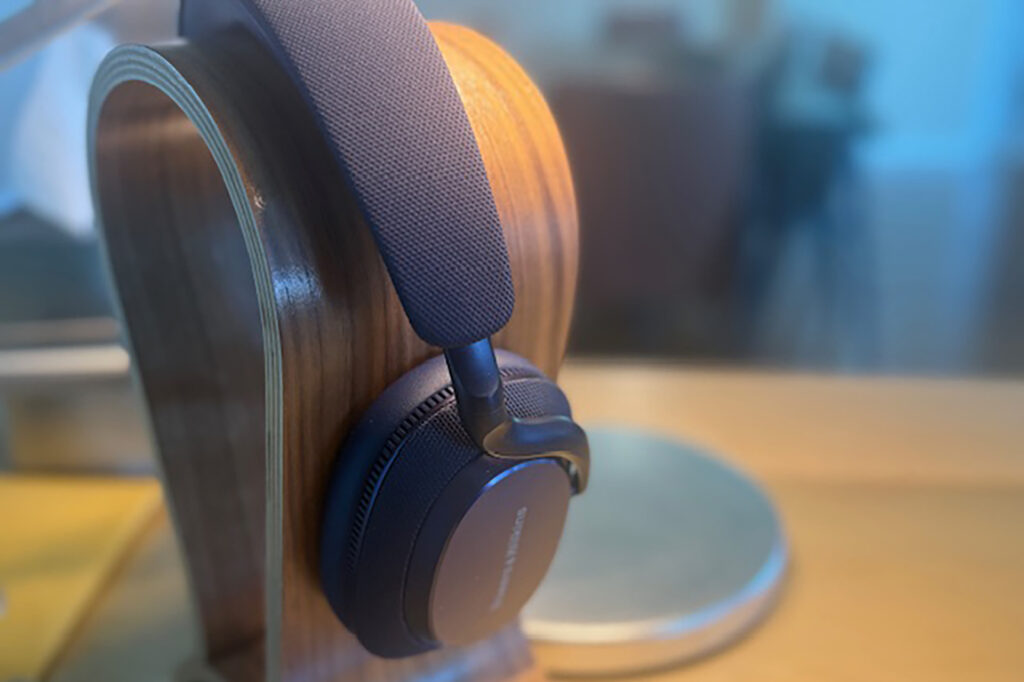 The Bowers & Wilkins Px7 S3 headphones on a stand on Jerry's Del Colliano's desk.