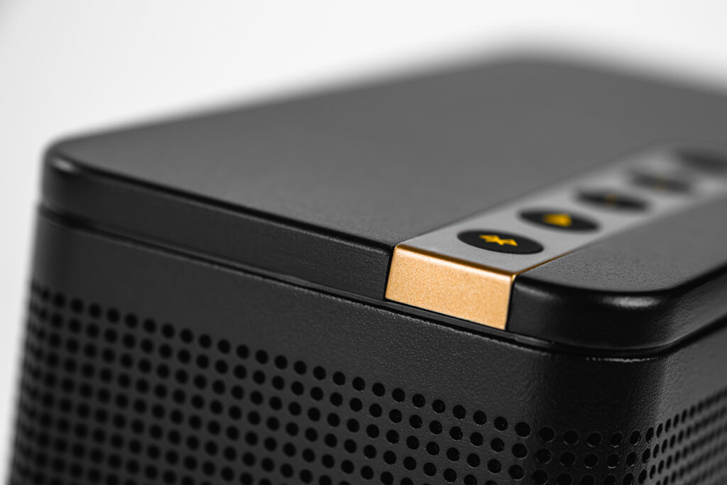 A close up of the hard buttons on the top of the ELAC NAVA 100.