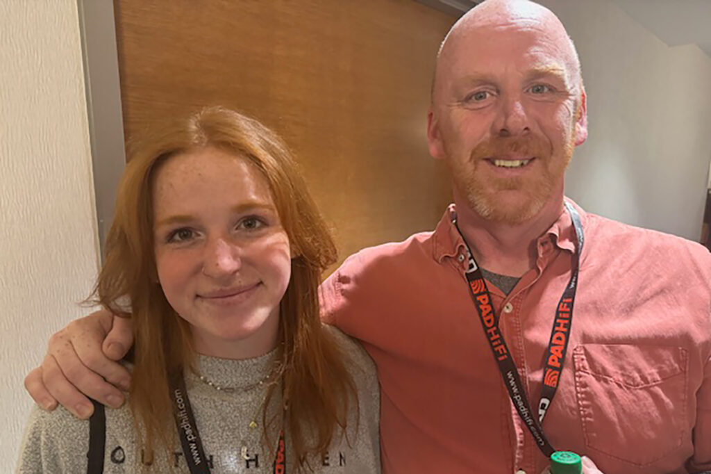 A young female audiophile with her Dad at AXPONA 2025. 