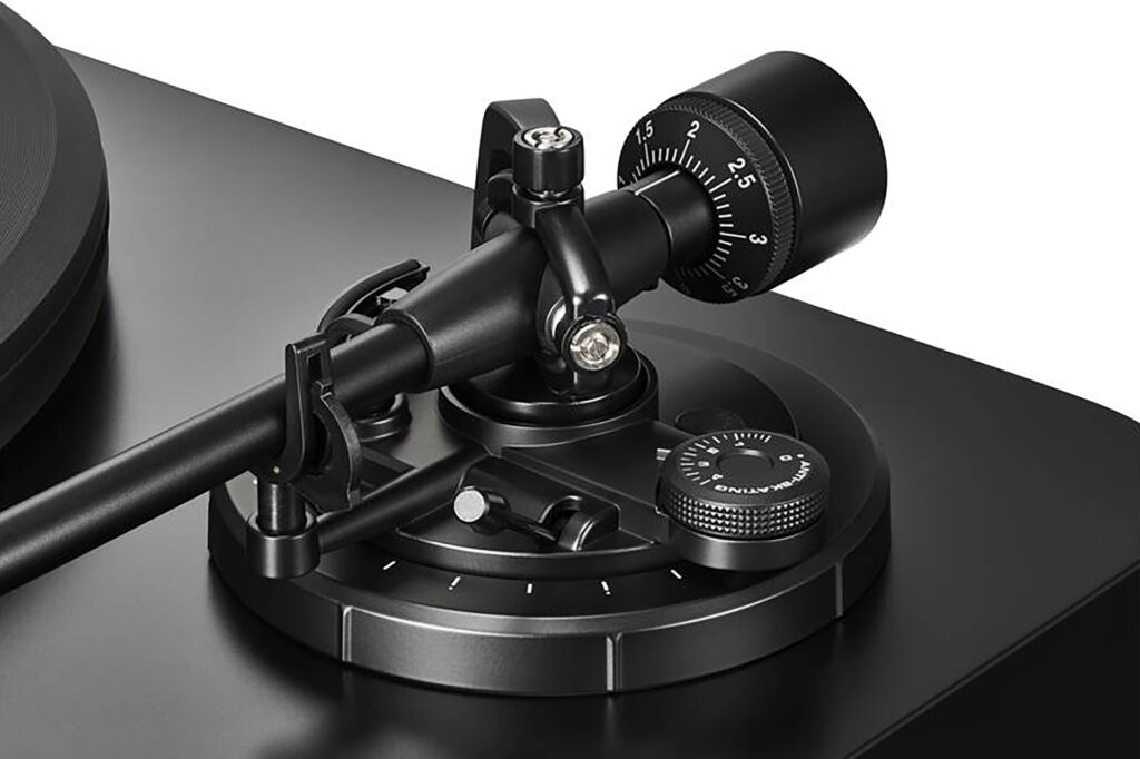 A close-up of the tonearm of the Audio-Technica LP7X turntable.