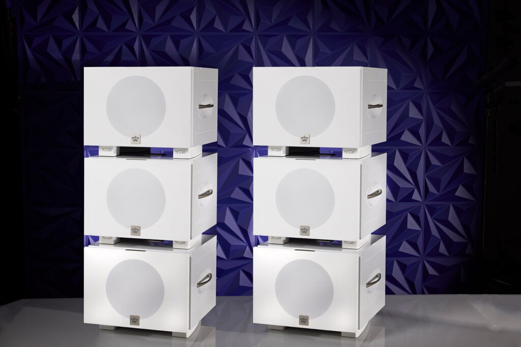 The REL S/550 Six Pack Line Array Sub Bass System in white with the grills on.