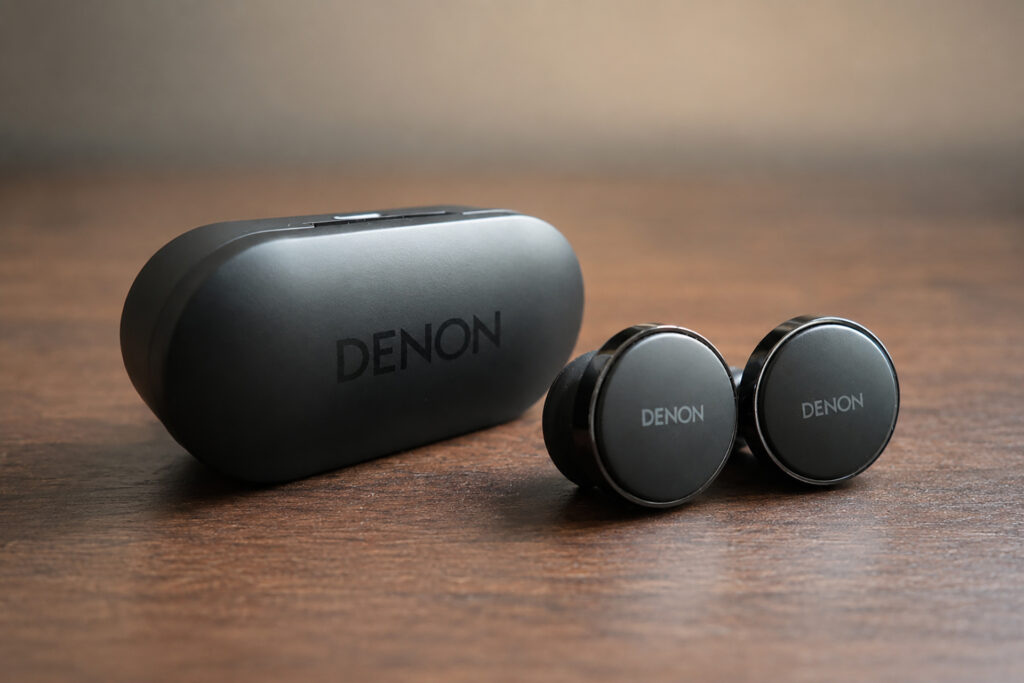 The Denon PerL Pro Earbuds with their protective/charging case.