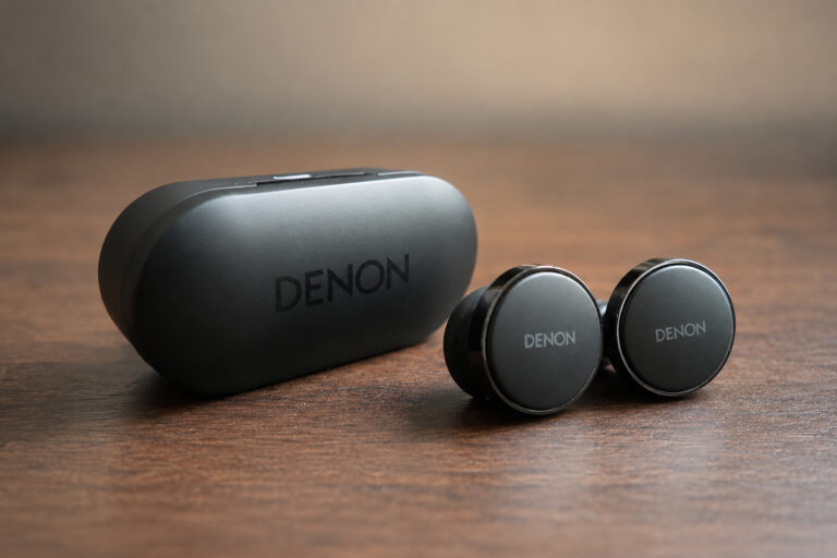 The Denon PerL Pro Earbuds with their protective/charging case.