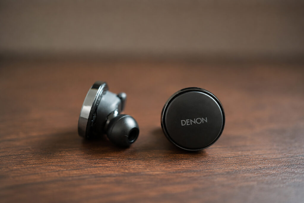 The Denon PerL Pro Earbuds out of their case. 