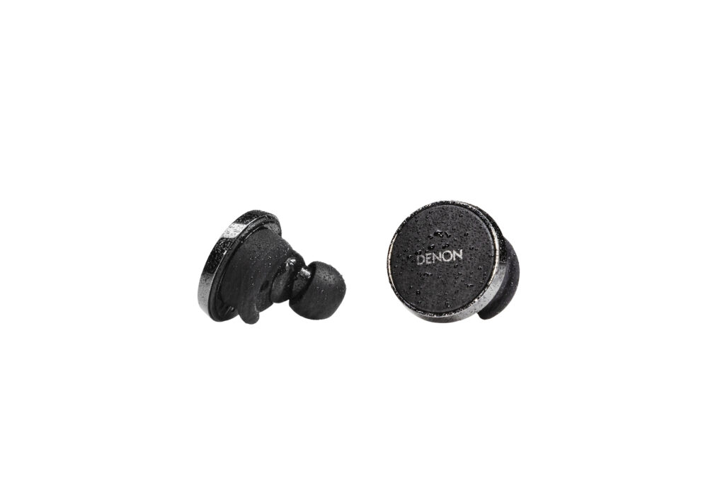 The Denon PerL Pro earbuds are cufflink-like in their form factor.