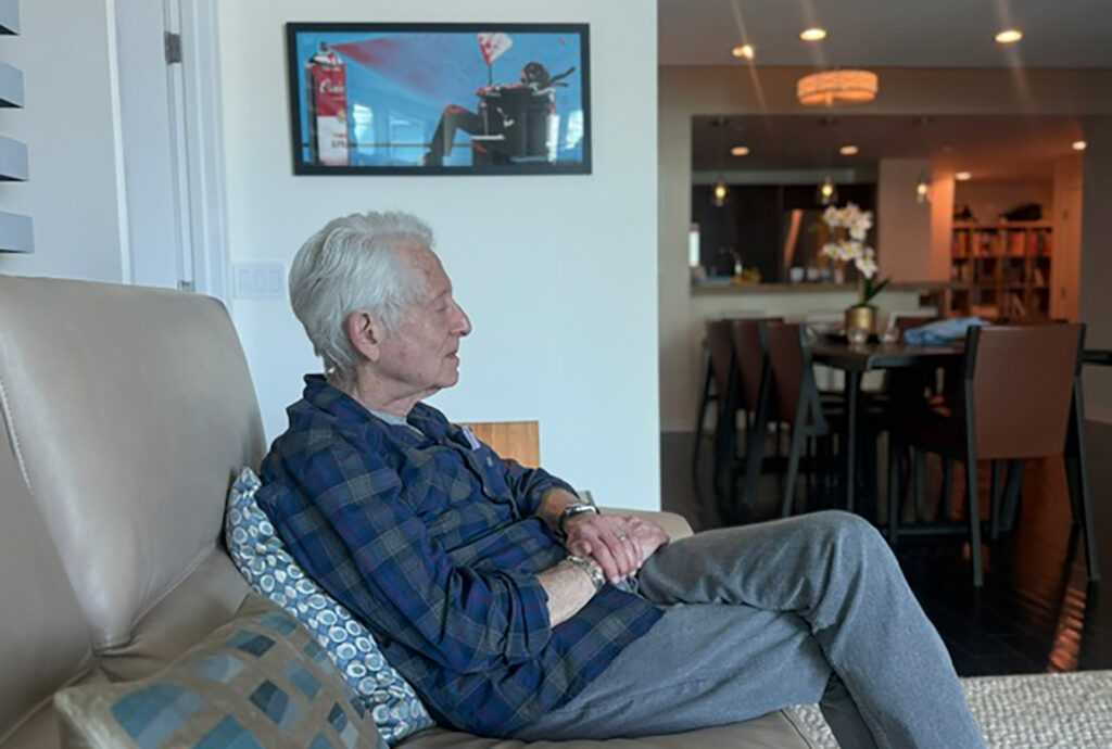 Mike Prager listening at Jerry Del Colliano's home in the summer of 2026.