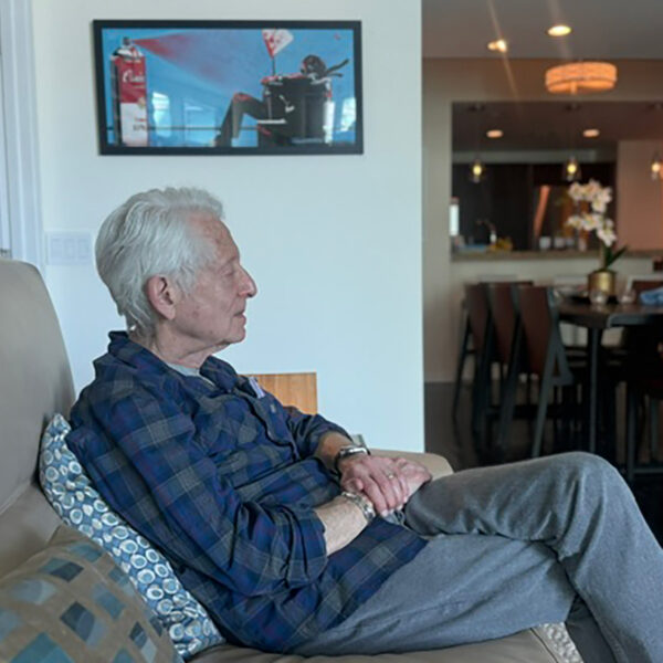 Mike Prager listening at Jerry Del Colliano's home in the summer of 2026.